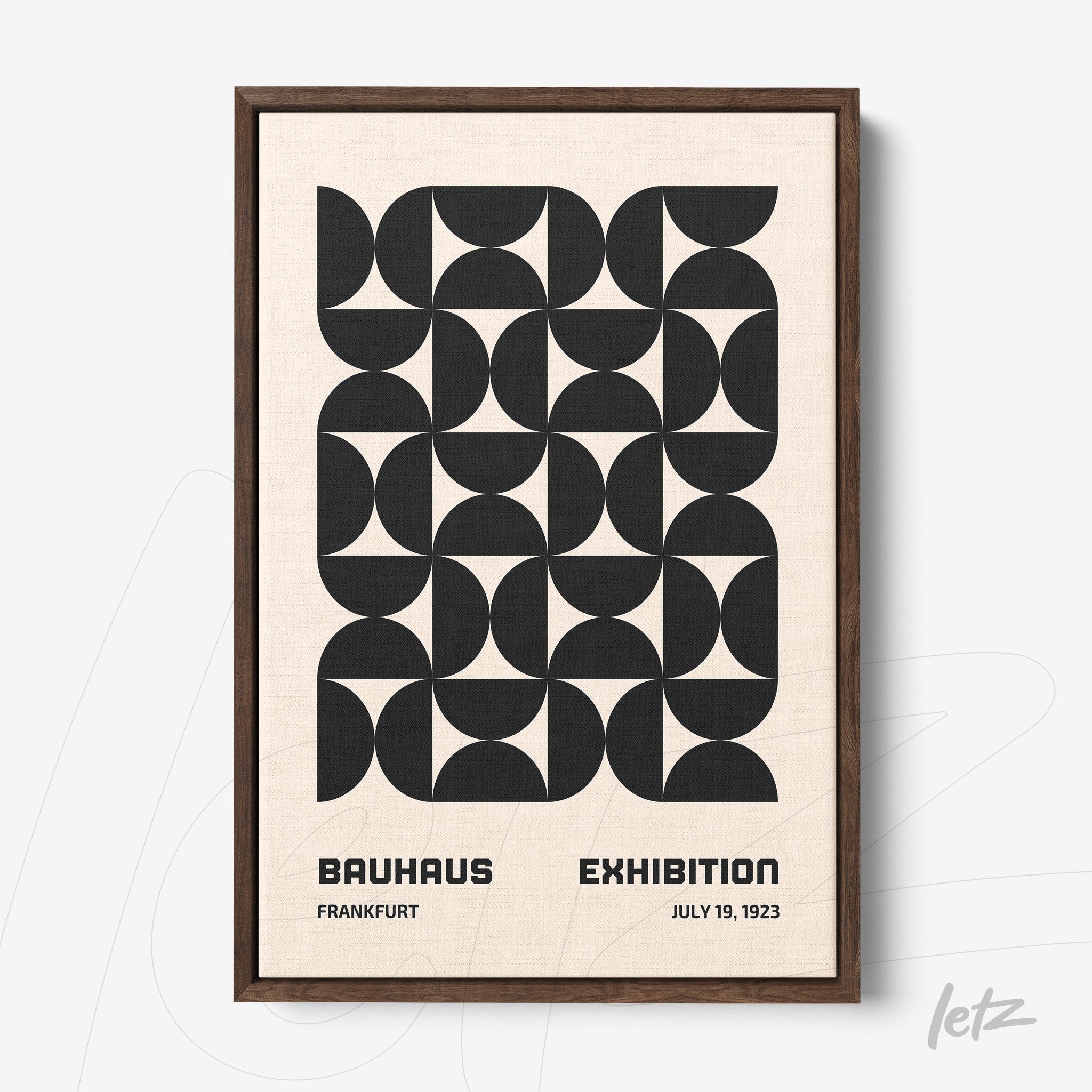 poster with black and white geometric pattern in dark wood frame