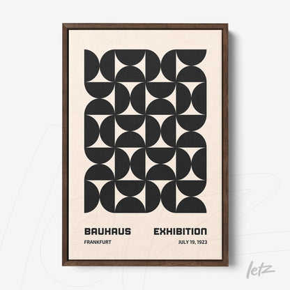 poster with black and white geometric pattern in dark wood frame