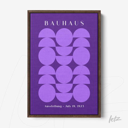 geometric design wall art in shades of purple with 'Bauhaus' text in dark wood frame