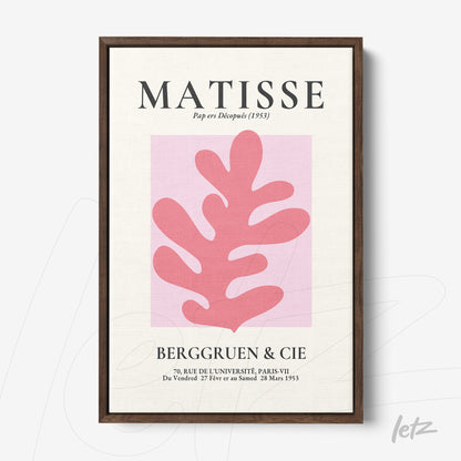 decorative wall art inspired by Henri Matisse featuring a pink leaf on a light background framed in dark wood