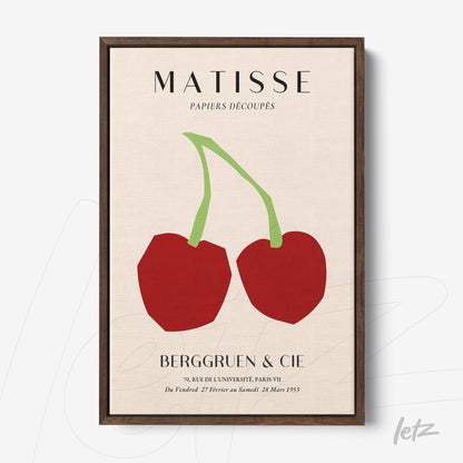 framed artwork of abstract cherries in cut paper style with dark wood frame