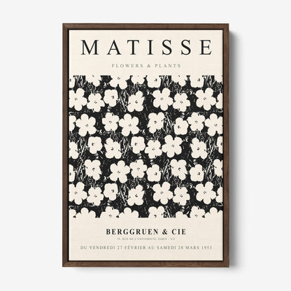 vintage style framed art featuring white flowers on a black background with dark wooden frame