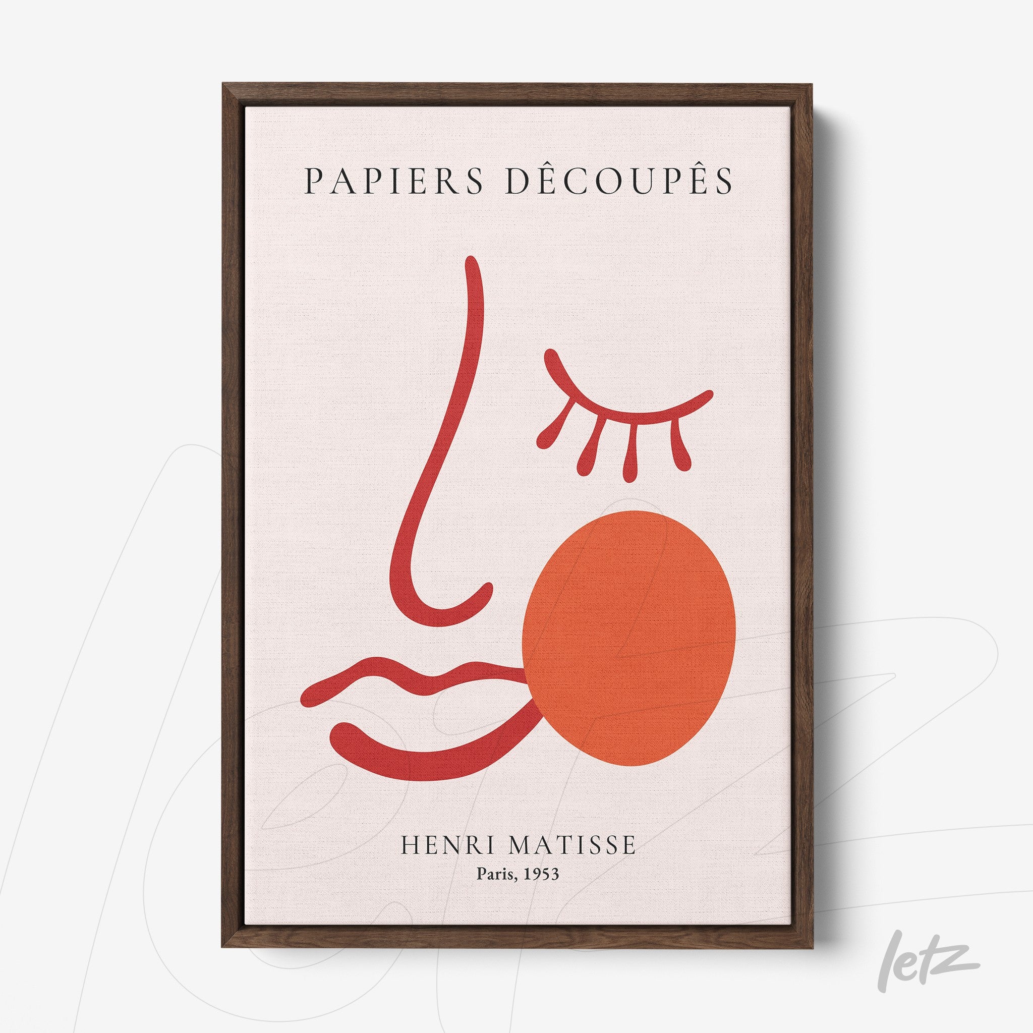 framed abstract art of a face in red and terracotta with the title PAPIERS DÉCOUPÉS and dark wood frame