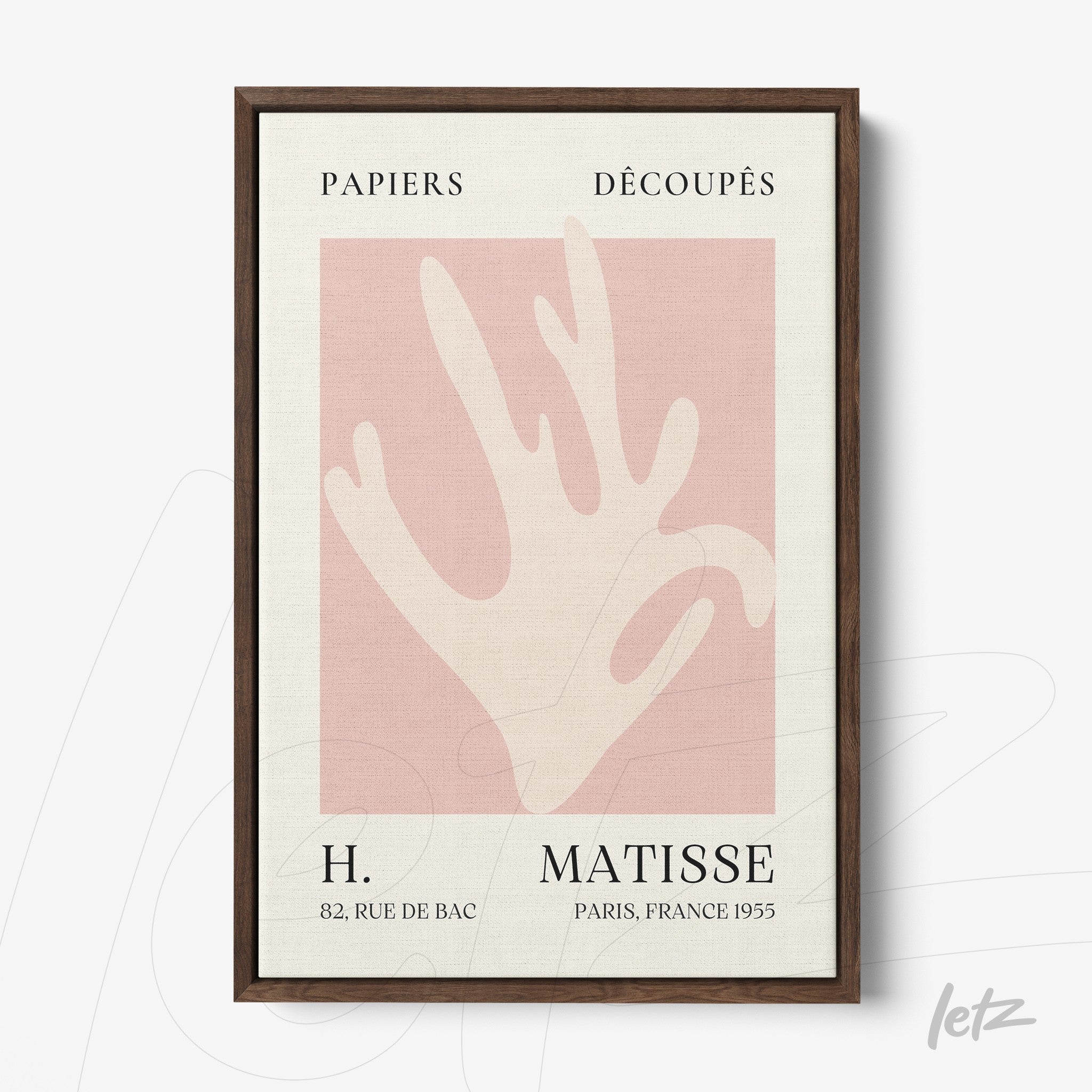 framed artwork by artist henri matisse featuring a hand silhouette on a light pink background with a dark frame