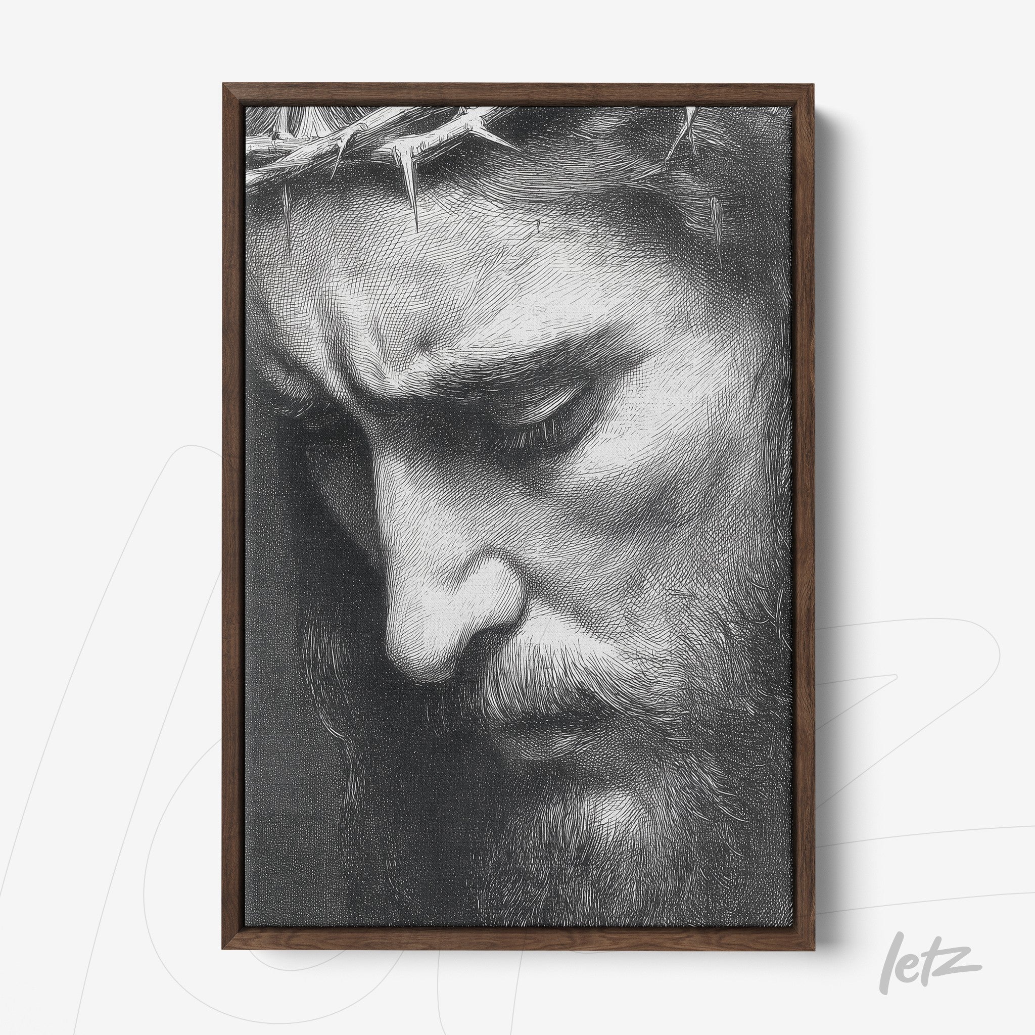 framed artwork featuring a black and white portrait of a contemplative male face with a crown of thorns