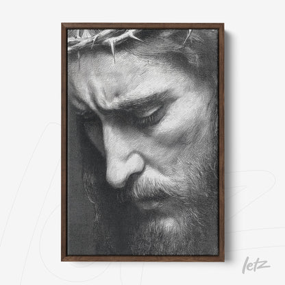 framed artwork featuring a black and white portrait of a contemplative male face with a crown of thorns