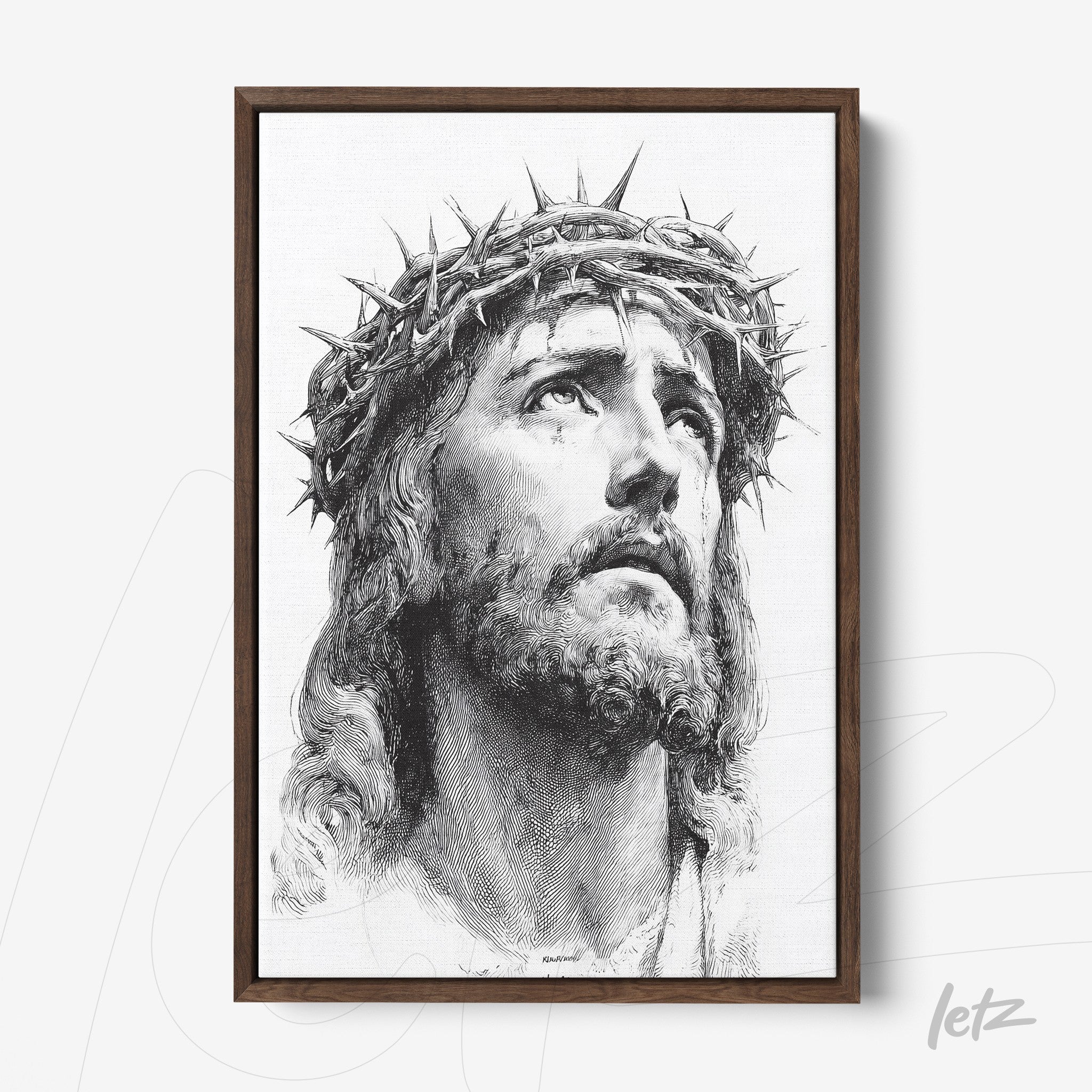 framed black and white portrait of Jesus Christ wearing a crown of thorns with a dark wood frame