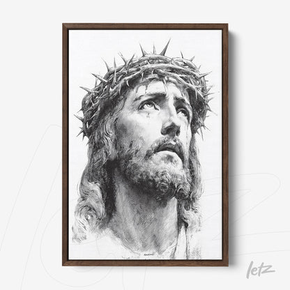 framed black and white portrait of Jesus Christ wearing a crown of thorns with a dark wood frame