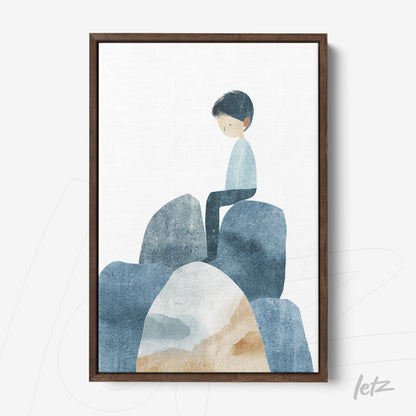 framed illustration of a boy sitting on rocks in shades of blue and beige with dark wood frame