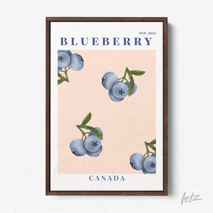 framed wall art featuring blueberries on a light pink background with dark wood frame