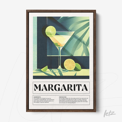 framed wall art featuring a stylized margarita cocktail with dark wood frame, green plant background, and sliced limes