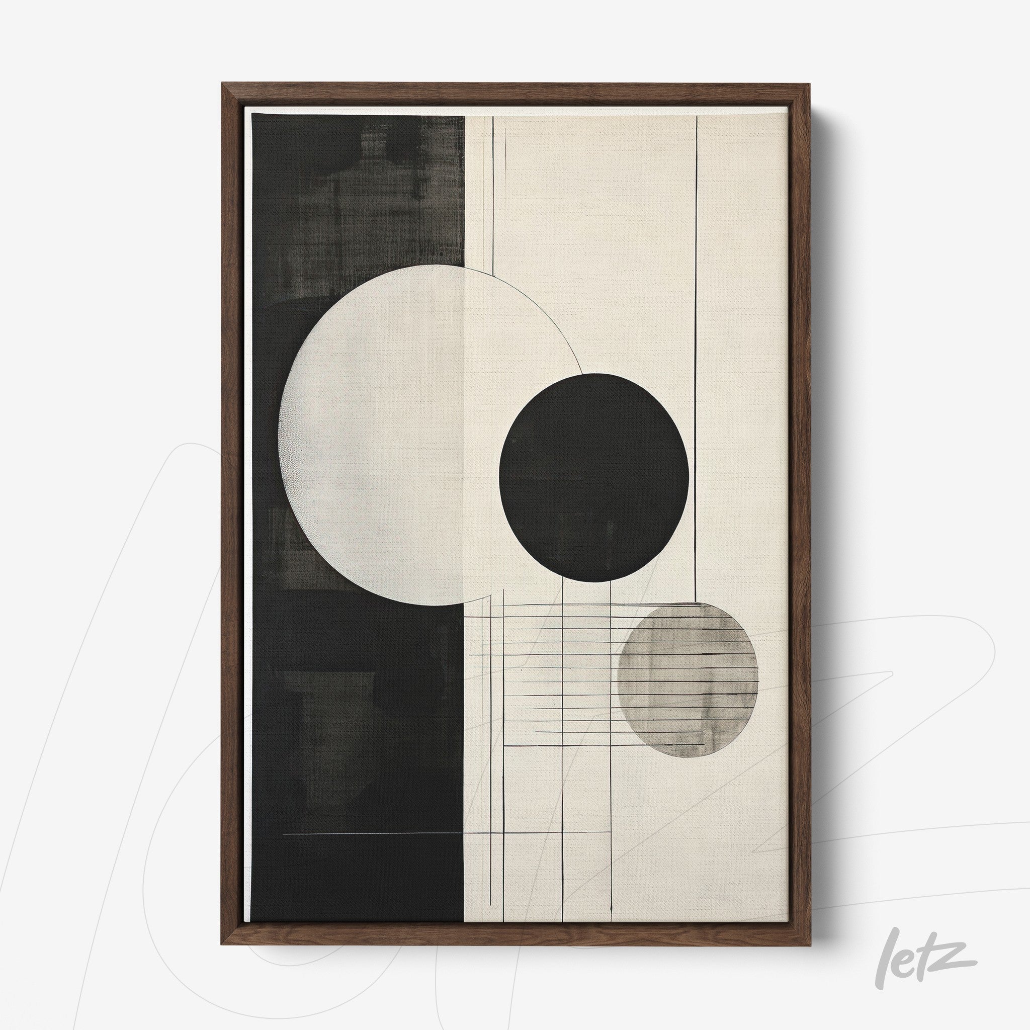 abstract wall art in black and white featuring circles and lines with dark wood frame