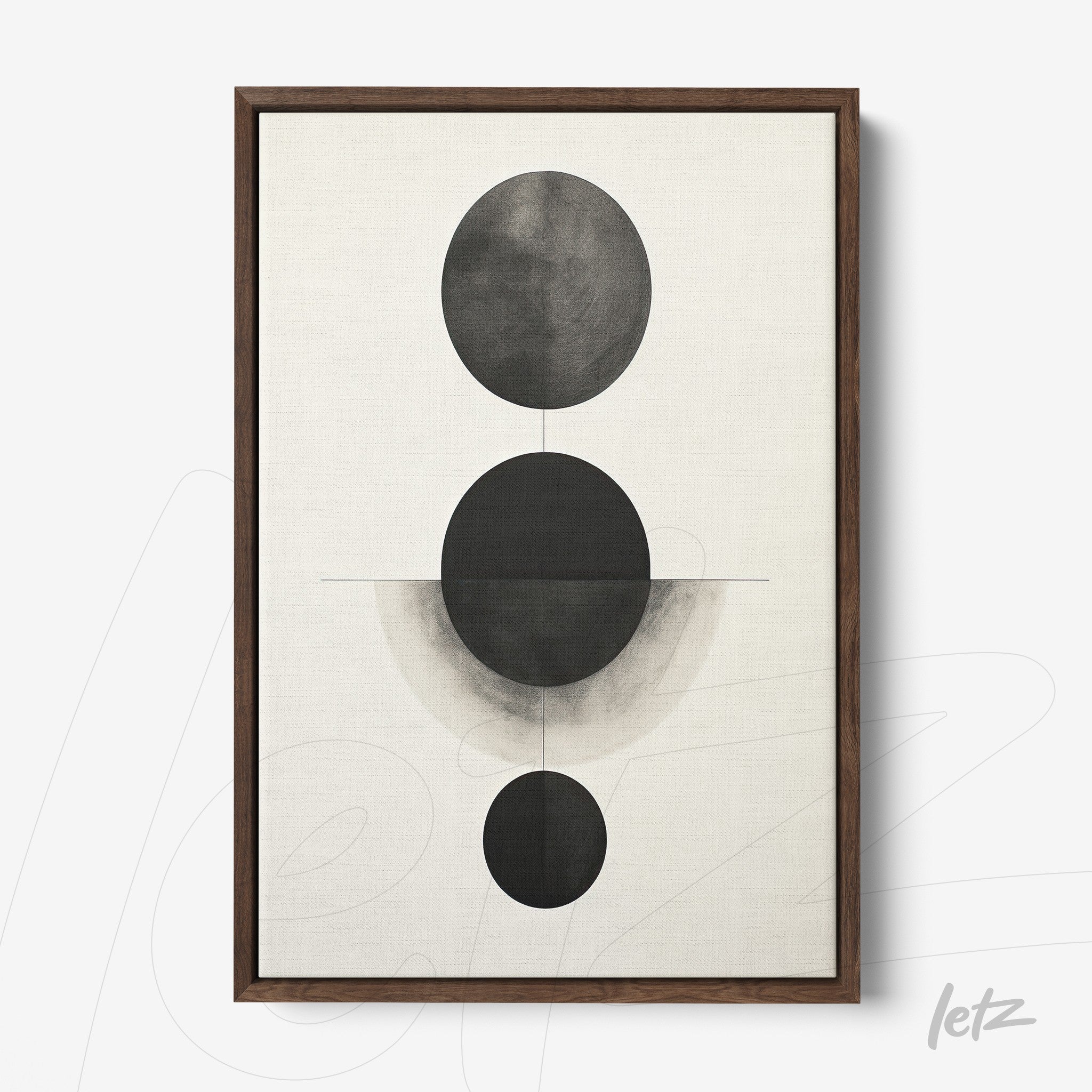 abstract wall art with black and gray tones featuring circular shapes in a minimalist composition, framed in dark wood