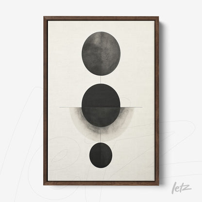 abstract wall art with black and gray tones featuring circular shapes in a minimalist composition, framed in dark wood