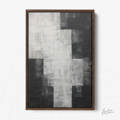 abstract wall art in shades of black and white with expressive texture in dark wood frame