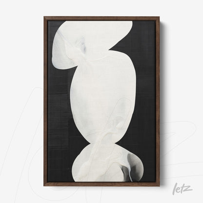abstract wall art in white tones on black background, framed with dark wood