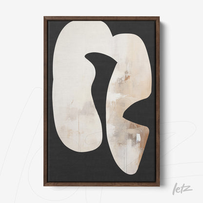 decorative wall art featuring abstract shapes in neutral tones set against a black background with dark wood frame