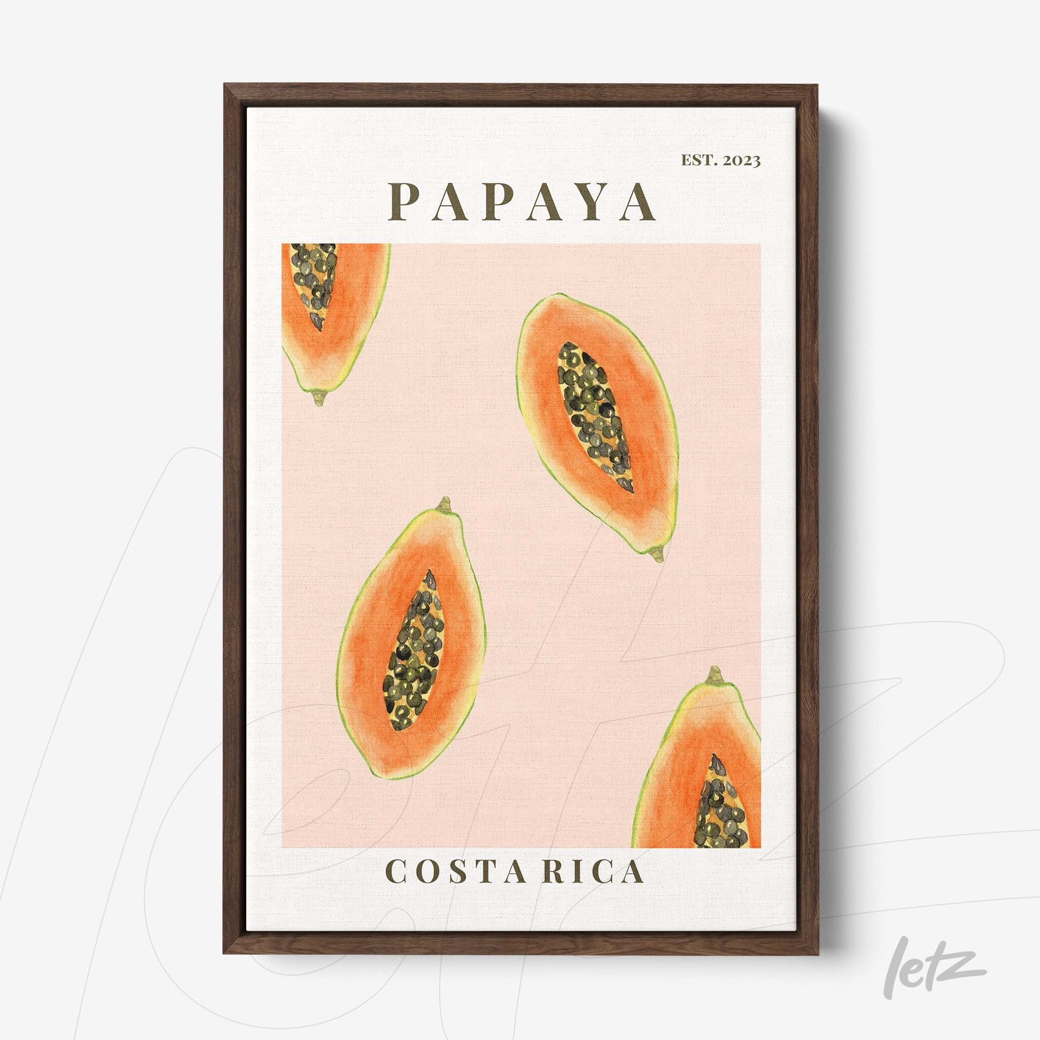 framed artwork featuring illustrations of papaya slices on a pink background with dark wood frame