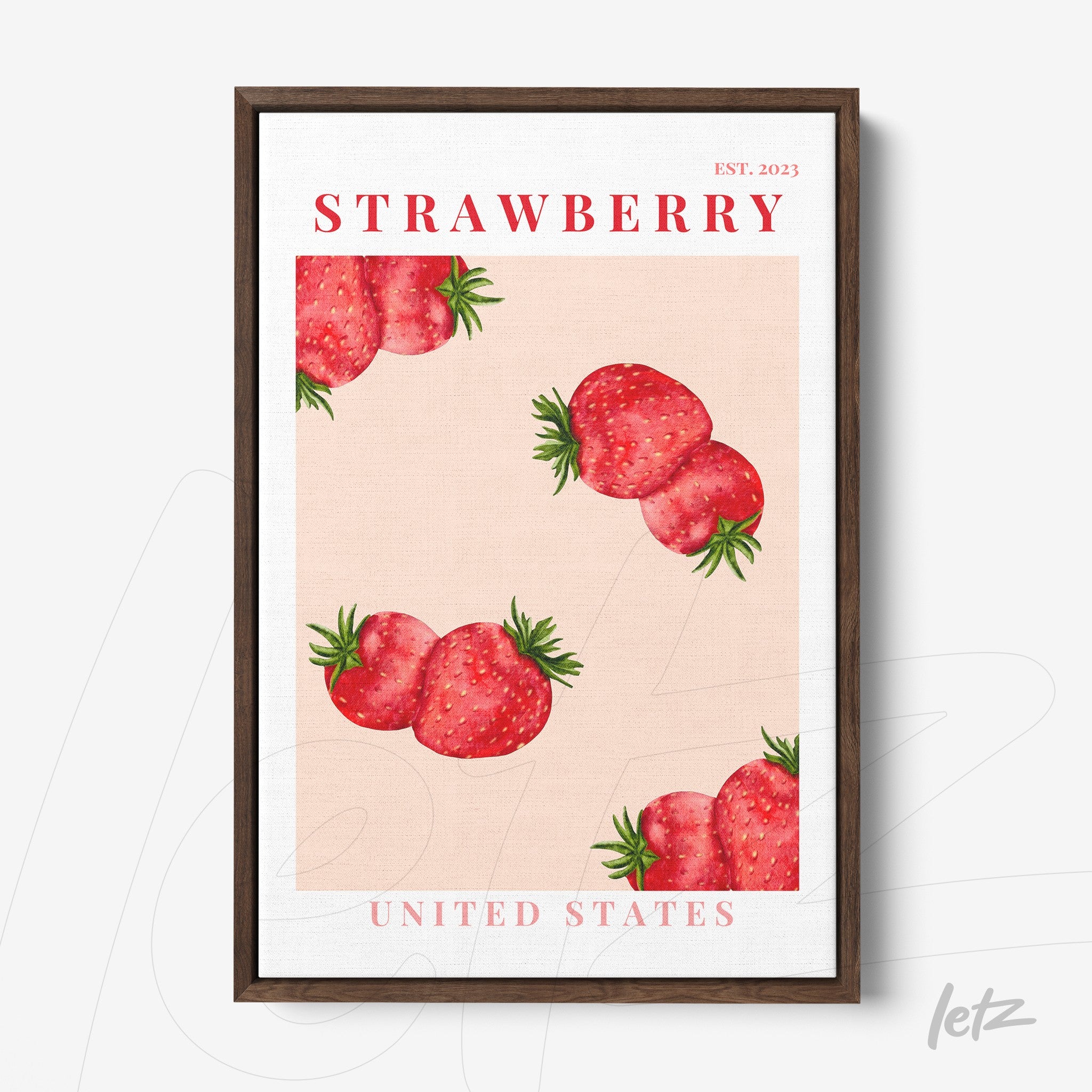 framed art piece featuring red strawberries on a pink background with a dark wood frame