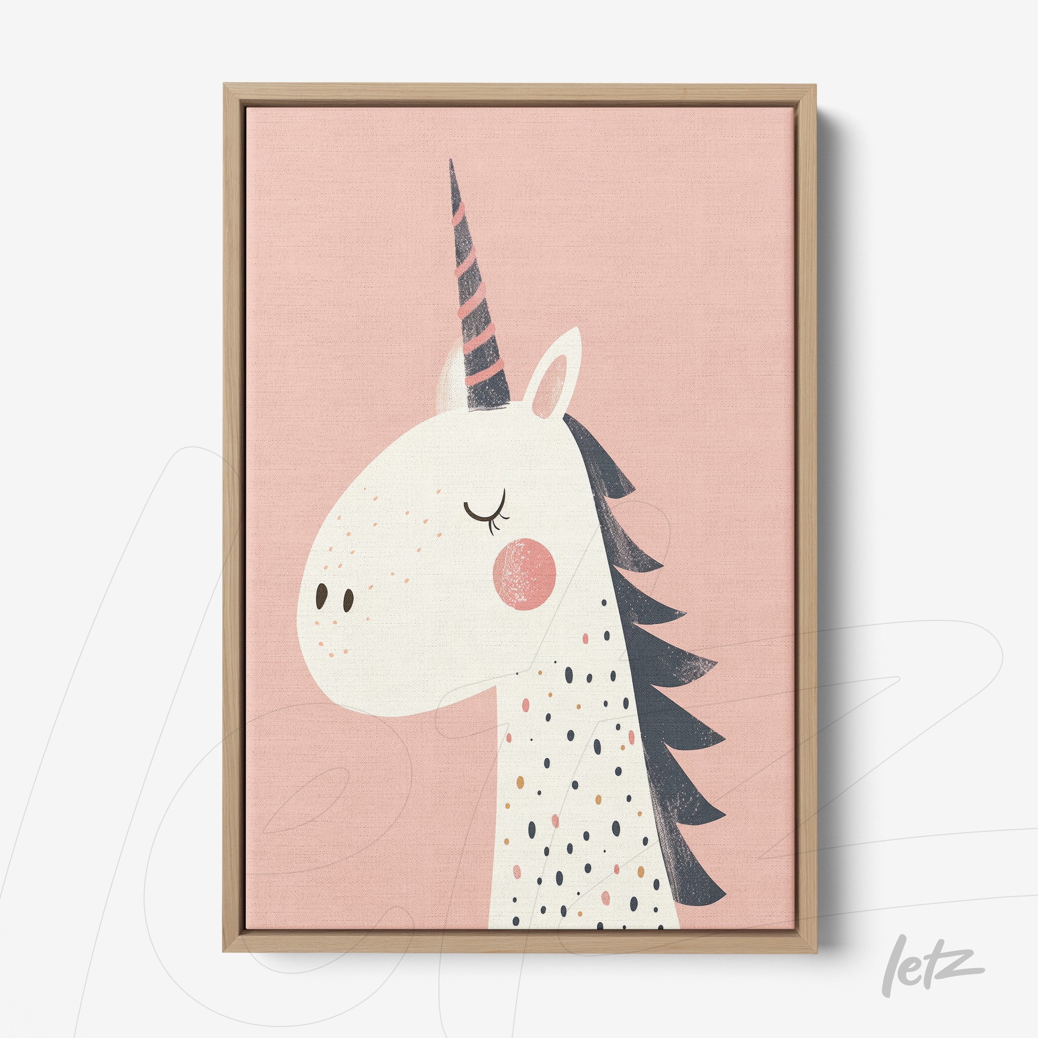 canvas print featuring a unicorn illustration on a light pink background with a light wooden frame