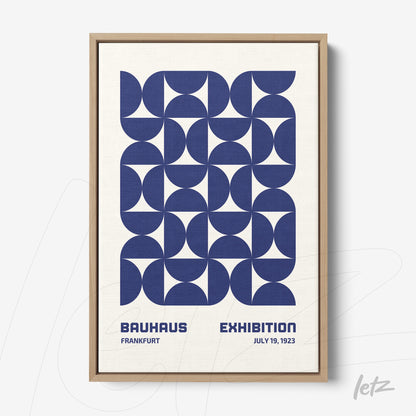 framed wall art featuring blue geometric Bauhaus style illustration with exhibition text