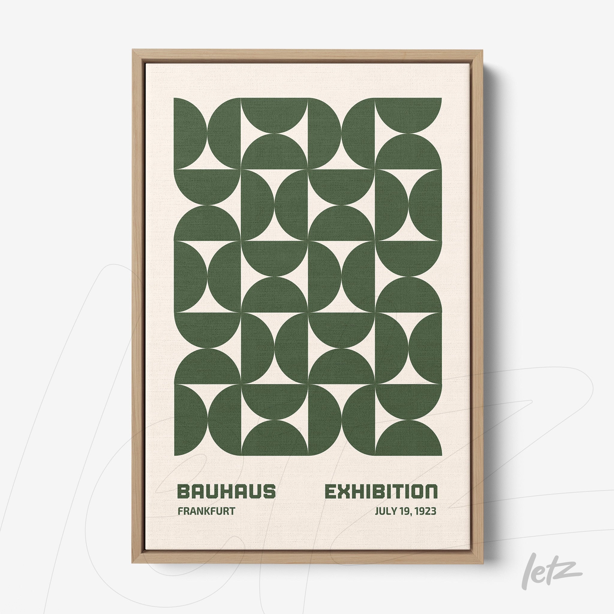 poster featuring green geometric design in natural wood frame displayed on white background