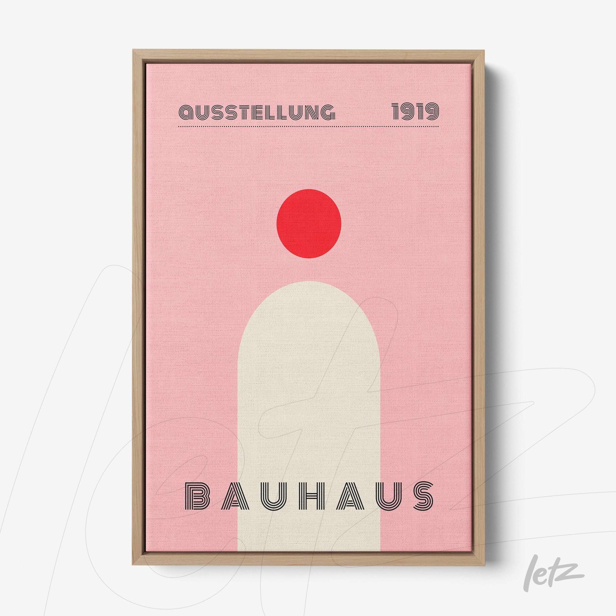 bauhaus style poster print with pink background and geometric shapes in light wood frame