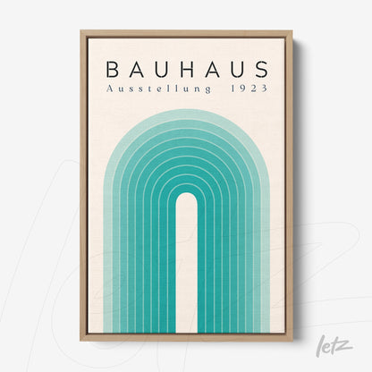 geometric design wall art in blue and green tones, displayed in light wood frame