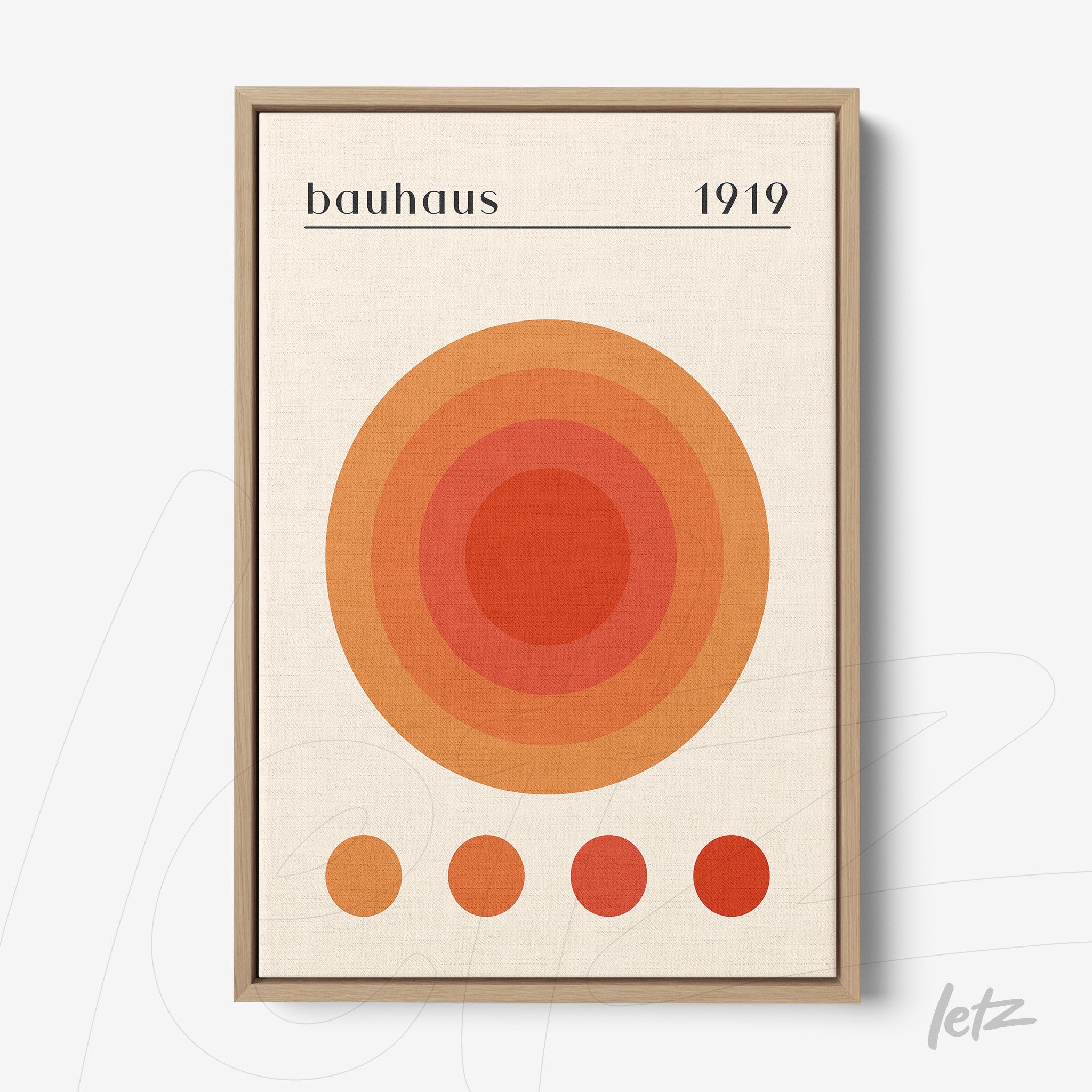 poster featuring concentric circles in orange and red hues within a light wooden frame