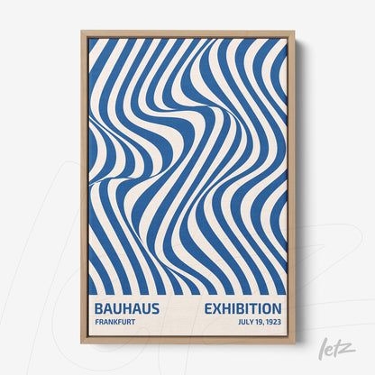 printed poster with blue and white wavy geometric design, displayed in a light wood frame