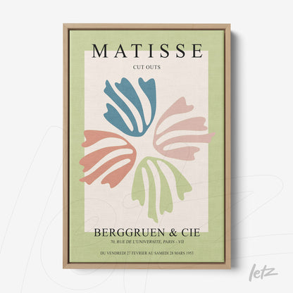 framed modern art inspired by Matisse featuring pastel leaf shapes on light green background with light wood frame