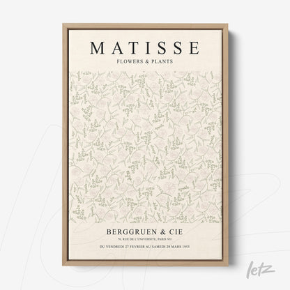 framed vintage style wall art featuring floral pattern in soft colors and light wood frame