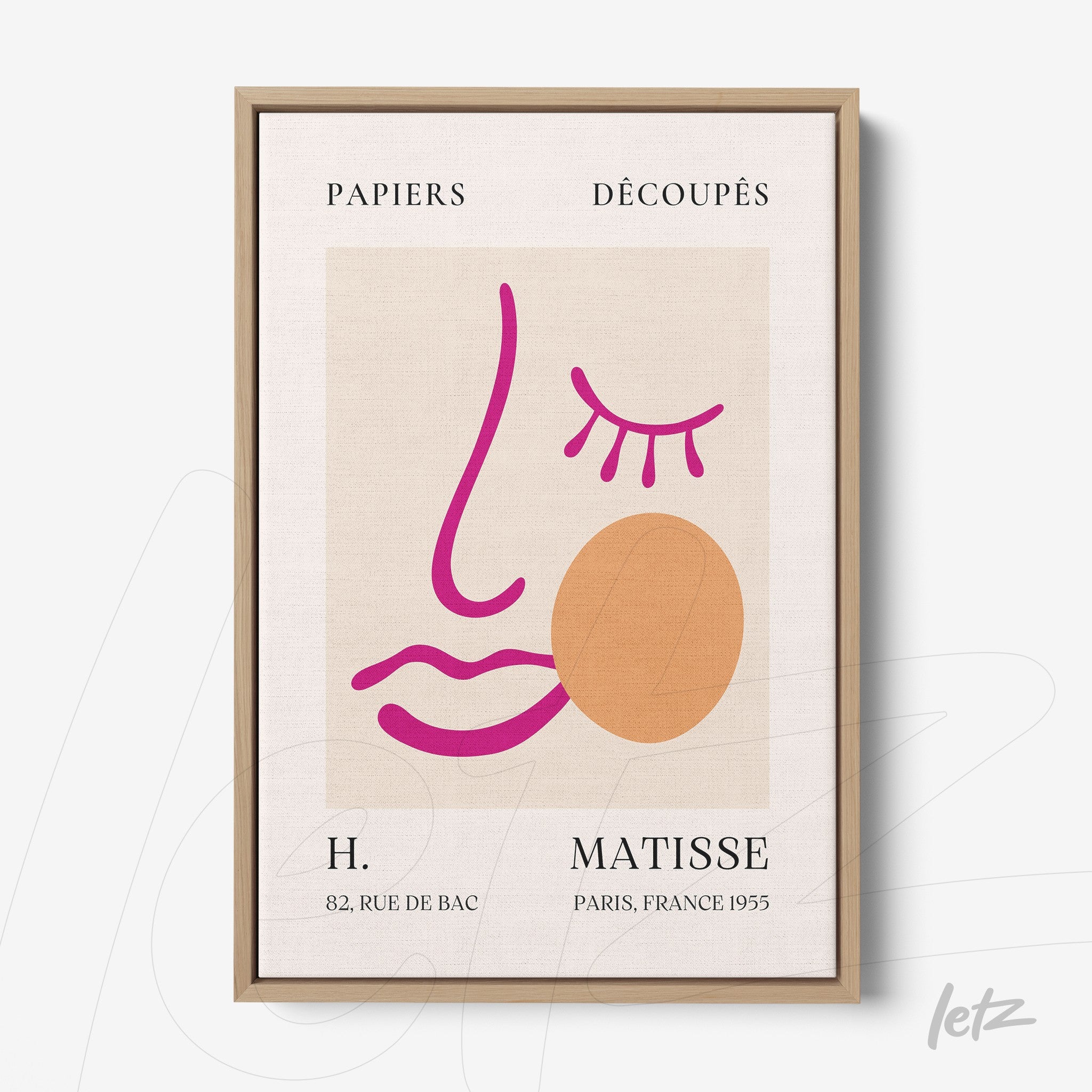 framed modern abstract art featuring a simple face design with colorful lines and geometric shapes in a light wood frame
