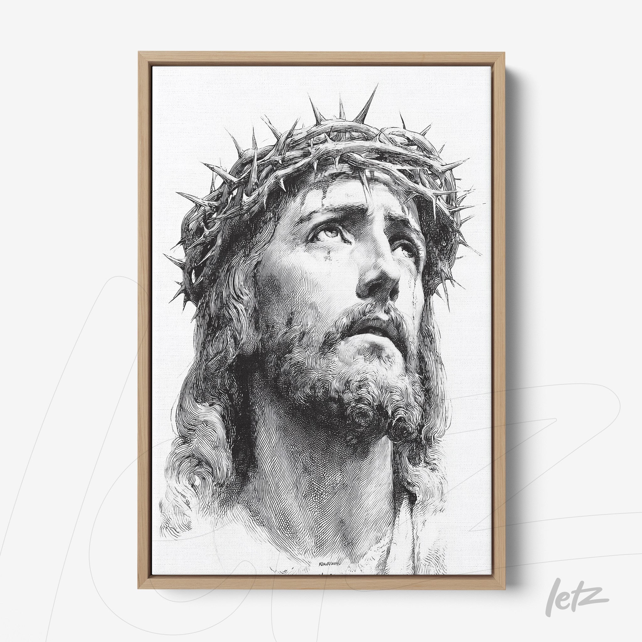 canvas print featuring a portrait of Jesus Christ wearing a crown of thorns in light wood frame