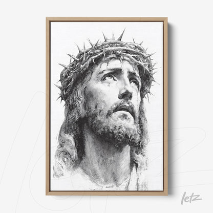 canvas print featuring a portrait of Jesus Christ wearing a crown of thorns in light wood frame