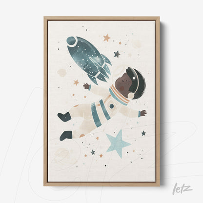 framed wall art featuring a child astronaut floating in a cosmic background with a light wooden frame