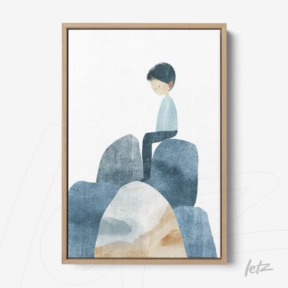 framed artwork featuring a boy sitting on blue-toned rocks