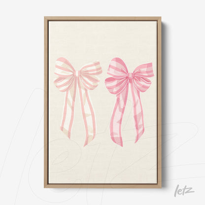 canvas print featuring illustration of pink ribbons on light background in light wood frame