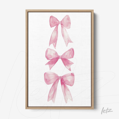 canvas wall art featuring pink ribbon illustrations on white background with light wood frame