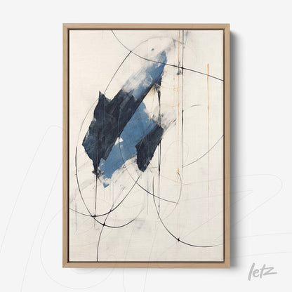 framed abstract art featuring shades of blue and black on a light background with a light wood frame