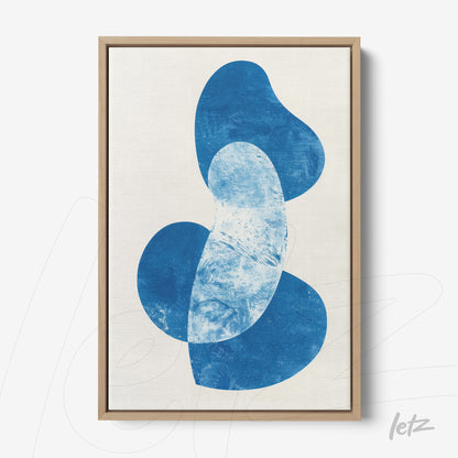decorative wall art featuring organic blue shapes on light background with light wood frame