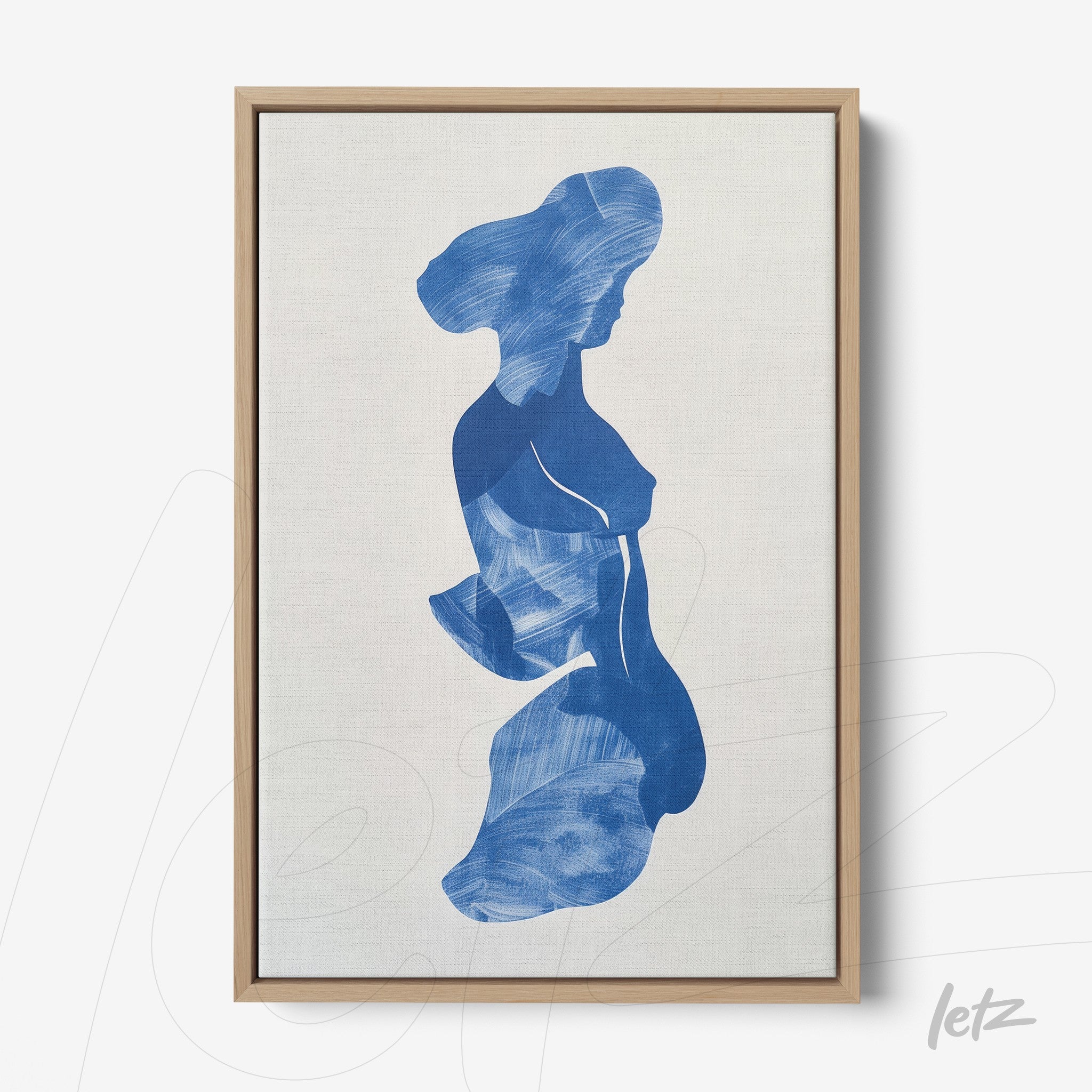 abstract wall art in blue depicting a woman's silhouette in light wood frame