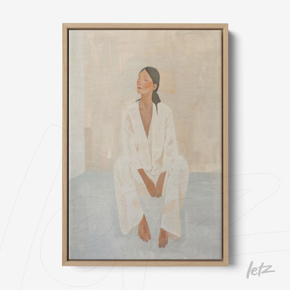 framed artwork of a seated female figure in light clothing against a neutral background with a light wood frame