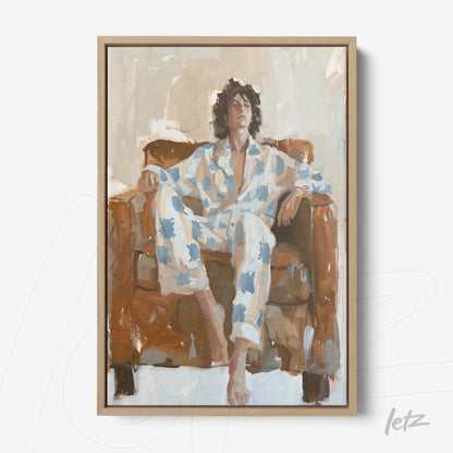 framed art depicting a man relaxing on a brown sofa wearing blue patterned pajamas
