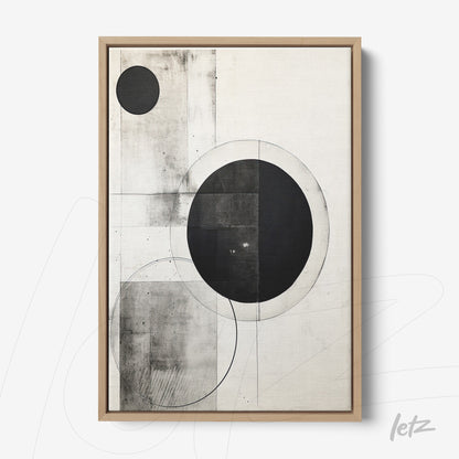 abstract wall art in black and white featuring geometric shapes like circles and squares in a minimalist composition within a light wood frame