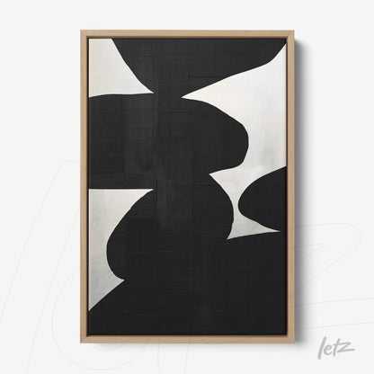 modern wall art featuring abstract black and white shapes with light wood frame