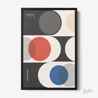 canvas print with bauhaus geometric art in black frame against white wall