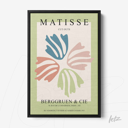 framed contemporary art print featuring cutouts of leaves in soft colors with black frame