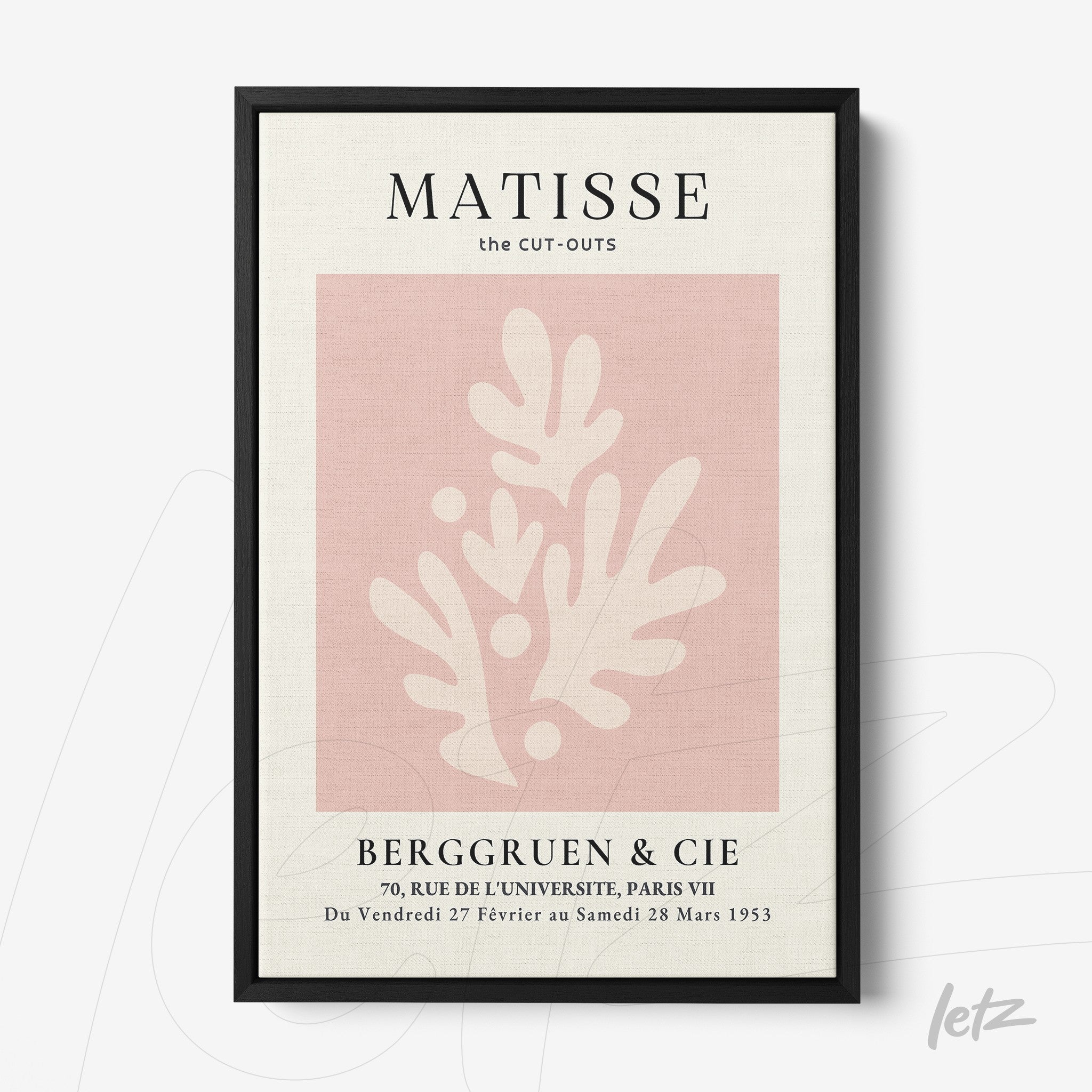 framed modern art piece featuring light pink background with abstract cream shapes and black frame