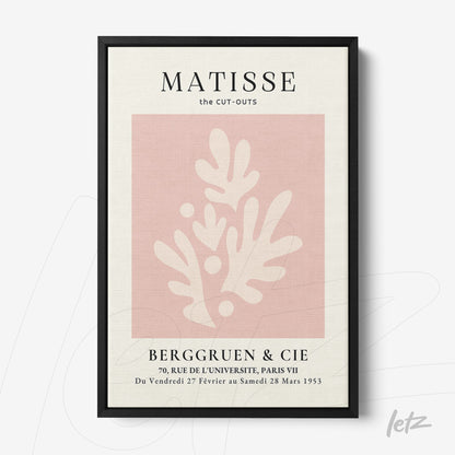 framed modern art piece featuring light pink background with abstract cream shapes and black frame